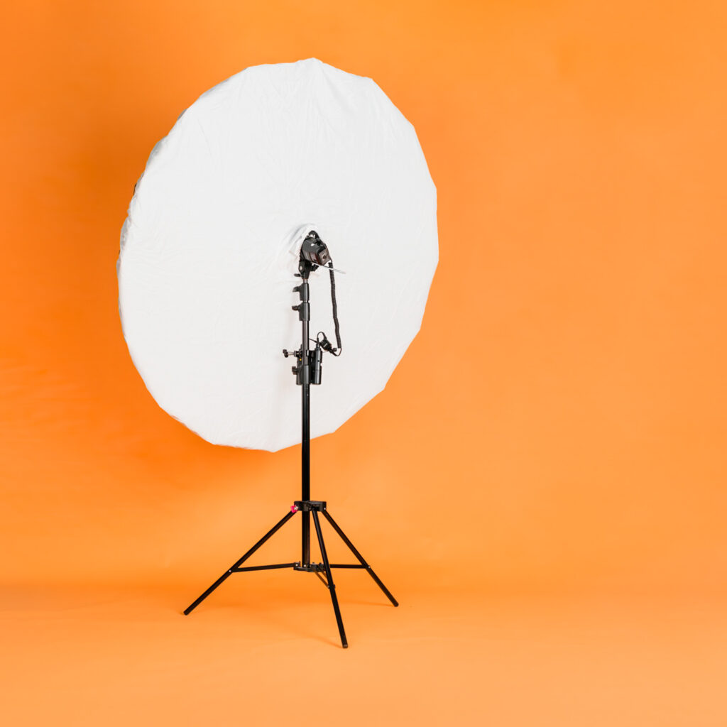 Large 6 ft umbrella modifier with Godox 360W srobe on light stand